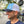 Side view of a man wearing the Iconic Monkee Mid Pro Trucker Hat in Columbia blue, white, and navy