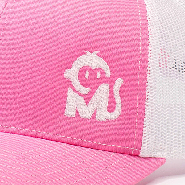 Close-up view of the Iconic Monkee Mid Pro Trucker Hat in hot pink and white