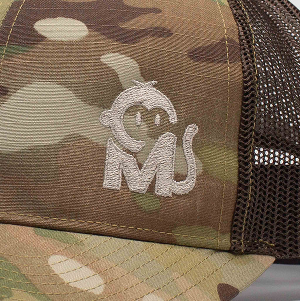 Close-up view of the Iconic Monkee Multicam Trucker Hat in original and coyote brown