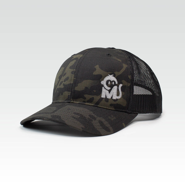 Front view of the Iconic Monkee Multicam Trucker Hat in black and black