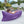 Young girl reading a book in a dark purple Chill Monkee inflatable lounger