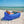 Man lying on a Chill Monkee Royal Blue Lazy Lounger on the beach.