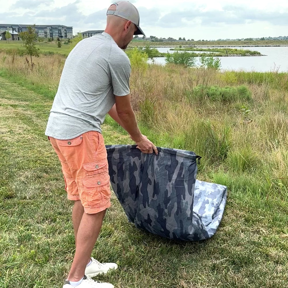 Man demonstrating how easy it is to inflate a Chill Monkee Lazy Lounger